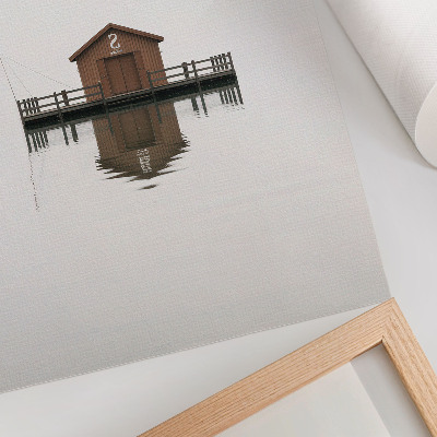 Lienzo decorativo moderno Una cabaña de madera de estilo minimalista junto al agua.