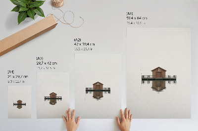 Lienzo decorativo moderno Una cabaña de madera de estilo minimalista junto al agua.
