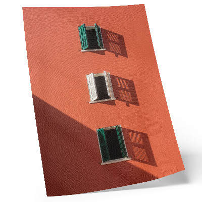 Lienzo decorativo moderno Pared naranja, tres ventanas, persianas verdes.