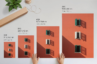 Lienzo decorativo moderno Pared naranja, tres ventanas, persianas verdes.