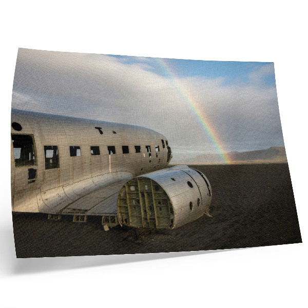 Arte de pared Los restos metálicos de un avión con un arcoíris de fondo.