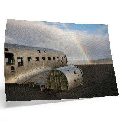 Arte de pared Los restos metálicos de un avión con un arcoíris de fondo.
