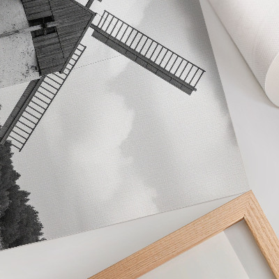 Arte de pared Un molino de viento blanco y negro en un campo con caballos.