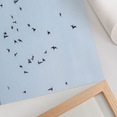 Arte de pared Una bandada de pájaros sobre el mar azul