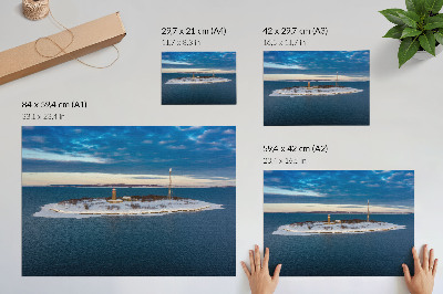 Lámina para cuadro Isla invernal con faro y mar azul