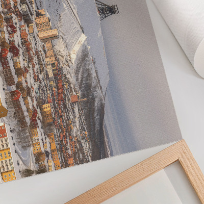 Arte de pared Pueblo invernal con edificios coloridos que contrastan con la nieve.