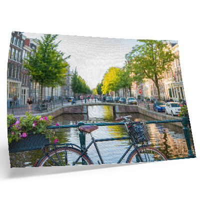 Lámina para cuadro Canal, puente, árboles, edificios, bicicleta, flores