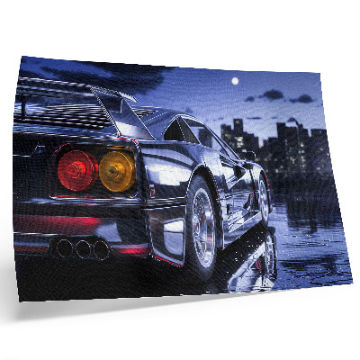 Arte de pared Un coche deportivo en un paisaje urbano por la noche.