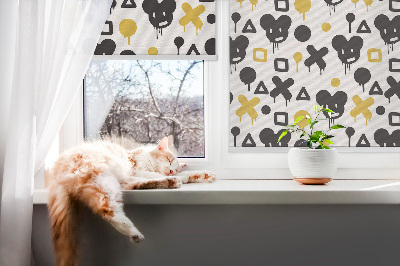 Estor decorativo con patrones negros y amarillos