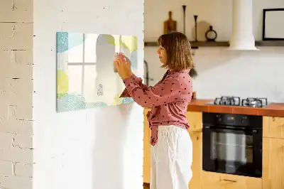 Pizarra de cristal borrable con imanes con marco decorado