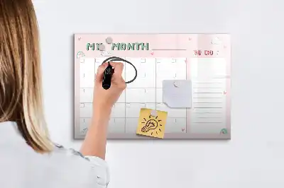 Pizarra magnética de pared con rotulador y diseño de planificador mensual infantil