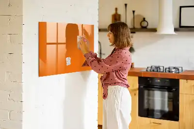 Pizarra borrable de cristal con imanes de color naranja