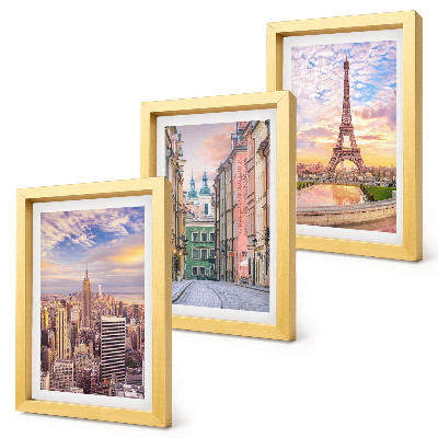 Juego de 3 cuadros decorativos Vista de las ciudades de Nueva York, París y Varsovia al atardecer.