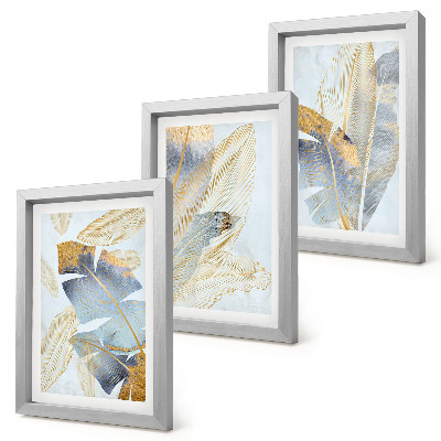 Juego de 3 cuadros decorativos Hojas en tonos azules y beige sobre un fondo claro.