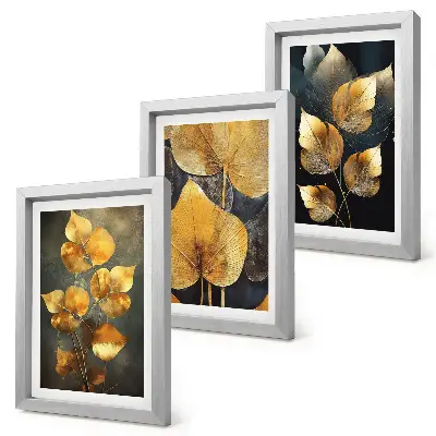 Juego de 3 cuadros decorativos con diseño de hojas en tonos amarillos sobre fondo oscuro