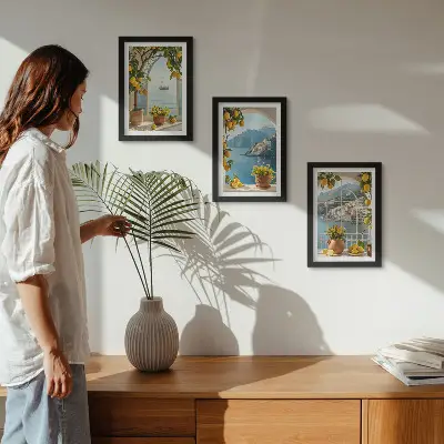 Juego de 3 cuadros decorativos con diseño de limones y flores en macetas en un pueblo costero