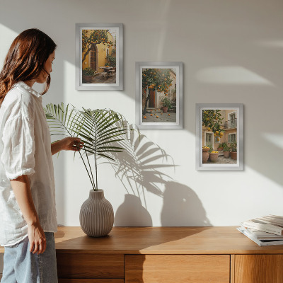 Juego de 3 cuadros decorativos Un jardín con árboles cítricos en un entorno soleado.