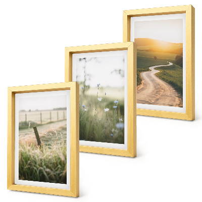 Tríptico enmarcado Paisaje con una pradera, un camino y una puesta de sol.