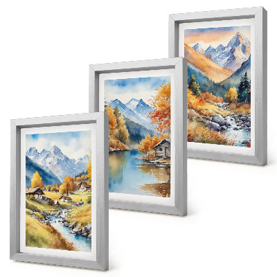 Juego de 3 cuadros decorativos Montañas otoñales pintadas con un río y cabañas.
