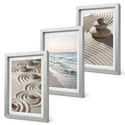 Juego de 3 cuadros decorativos Olas tranquilas de arena y agua con piedras en la playa.