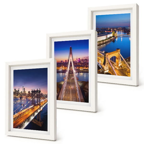 Juego de 3 cuadros decorativos Vistas nocturnas de ciudades con puentes y ríos.
