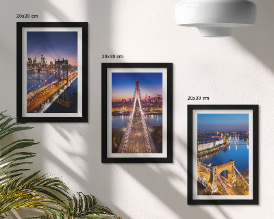 Juego de 3 cuadros decorativos Vistas nocturnas de ciudades con puentes y ríos.