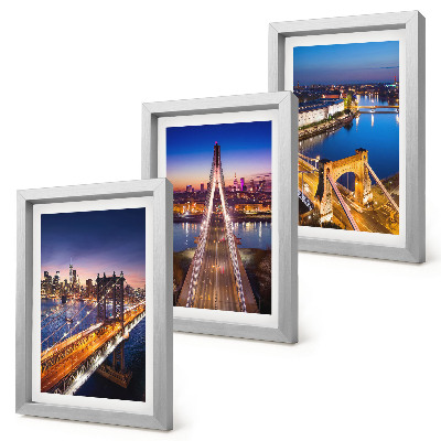 Juego de 3 cuadros decorativos Vistas nocturnas de ciudades con puentes y ríos.