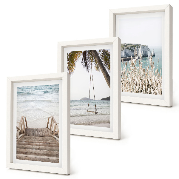 Juego de 3 cuadros decorativos Playa con escaleras de madera y columpio junto al mar.