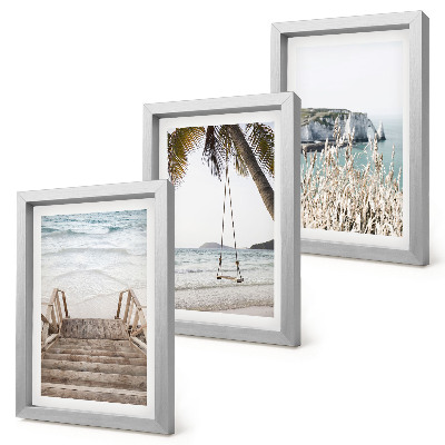 Juego de 3 cuadros decorativos Playa con escaleras de madera y columpio junto al mar.