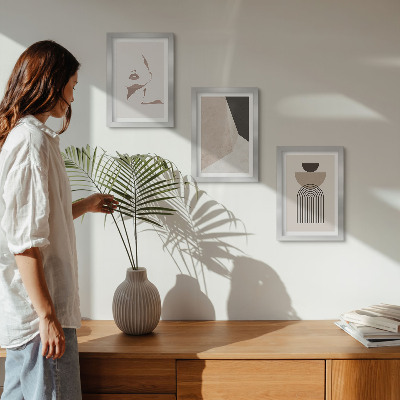Juego de 3 cuadros decorativos Formas geométricas abstractas y el rostro de una mujer.