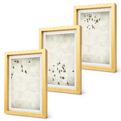 Tríptico enmarcado Una pintura minimalista de pájaros volando