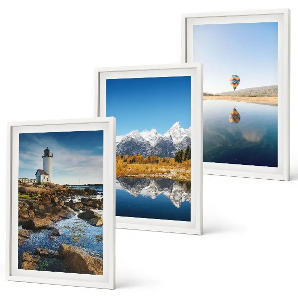 Set de 3 cuadros para salón con paisajes de naturaleza que incluyen un faro, montañas y un globo